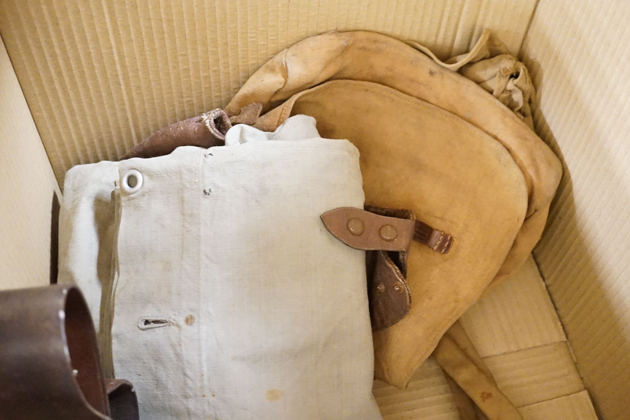 Miscellaneous WWI accessories including a water bottle, and a WWII Japanese pilot's cap